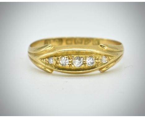 A antique hallmarked 18ct gold and diamond ring. The ring set with 5 old and singe cut diamonds in a boat setting with stylis