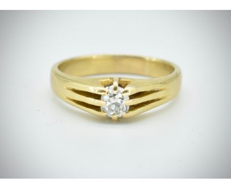 An 18ct gold and diamond ring. The ring set with an oval old cut diamond within a claw setting. Estimated diamond weight 0.60