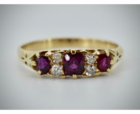 1)     An 18ct yellow gold, ruby and diamond seven stone ring. The ring with central ruby being 5mm x 4mm having diamond acce