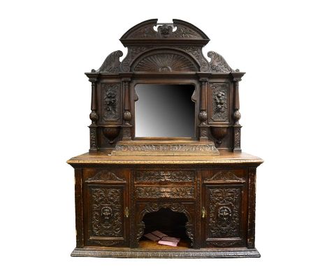 Victorian carved oak mirror back sideboard, architectural pediment with face mask above sunburst, shaped bevelled mirror glas