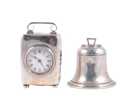 Silver cased table clock, indistinctely marked, rectangular with scrolled handle, four ball feet, white enamelled dial, 9.5cm