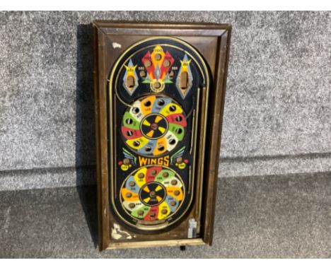 An old “wings” bagatelle game, housed in large wooden case