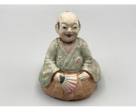 A vintage Chinese nodding man