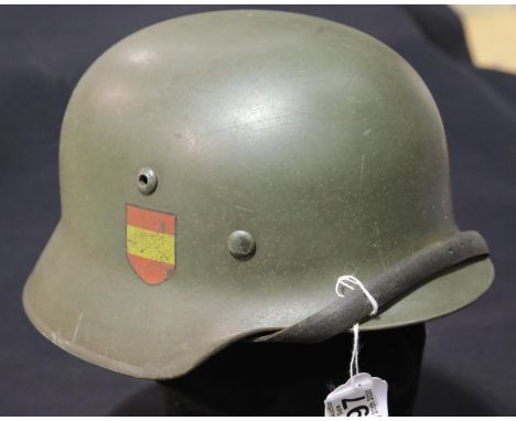 German WWII style helmet with liner and chinstrap. P&amp;P Group 2 (£18+VAT for the first lot and £2+VAT for subsequent lots)