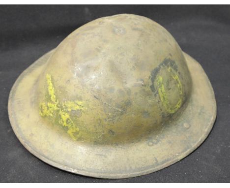 WWI type British Brodie helmet with liner and chinstrap with painted luck horseshoe decoration. P&amp;P Group 2 (£18+VAT for 