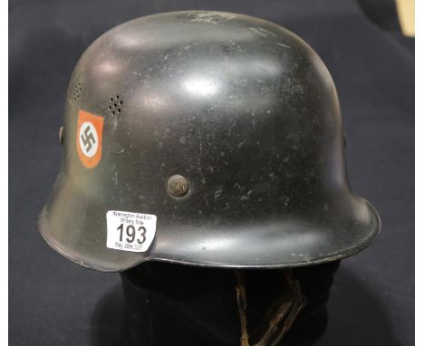 German WWII style helmet with liner, chinstrap and Swastika decals. P&amp;P Group 2 (£18+VAT for the first lot and £2+VAT for