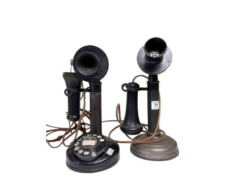 Two vintage stick telephones.