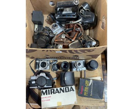 Collection of cameras and accessories including Canon T90, Minolta SR101, various lenses, etc.