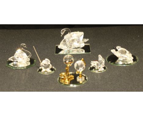 A Swarovski crystal model of a swan, 8.5cm wide, mirrored stand; other, Mouse, Frog, Desk Globe, others similar (7) 