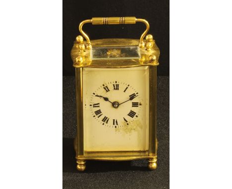 A French brass cased carriage clock, white enamel face, roman numerals, 11cm tall. 