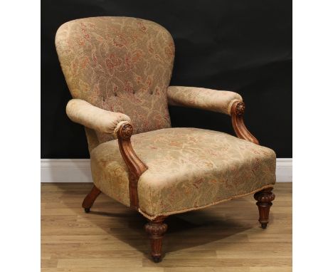 A Victorian oak library chair, by Johnstone and Jeanes, 67 New Bond Street, London, stamped, curved back, open arms, each han