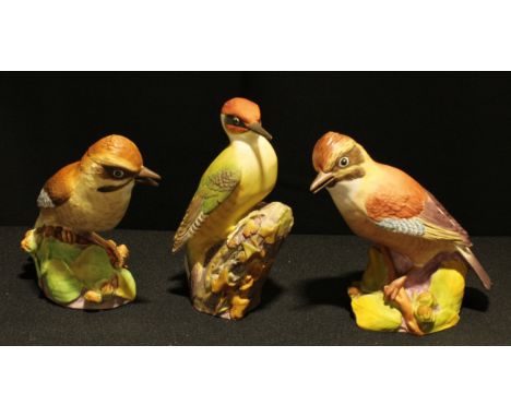 A Royal Worcester  Green Woodpecker, pattern No. 3249, and two Royal Worcester Jays, pattern No. 3248, (3). 