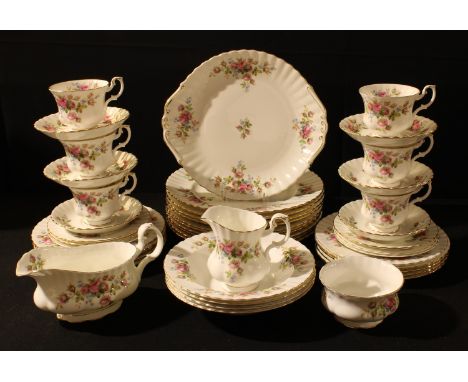 A Royal Albert Moss Rose pattern dinner and tea service, dinner plates, sauce boat, tecups and saucers, milk and sugar; qty 