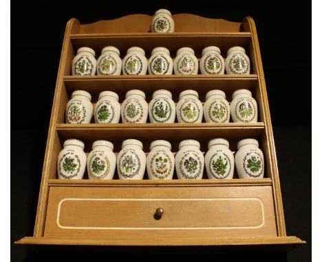 A set of twenty two Franklin Mint spice jars on kitchen rack, designed by Gloria Vanderbilt, including Saffron, Thyme, Sage, 