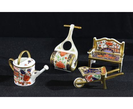 A Royal Crown Derby Imari palette miniature model of a garden bench, 8.5cm wide, printed mark, second quality; others, wheelb