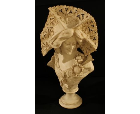 An Art Nouveau style bust of a young lady, 56cm tall. 