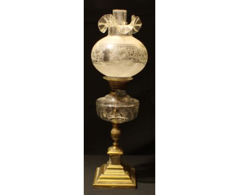 A late Victorian brass and glass oil lamp, square stepped pedestal base, clear and partially etched glass shade, 64cm high ov