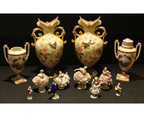 A pair of late Victorian blush ground mantel vases, decorated with birds, flowers and foliage, each 38cm high; a pair of Dres