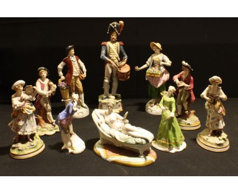 A group of continental figures, some as pairs including a Capodimonte model of a reclined scantily clad lady (10) 