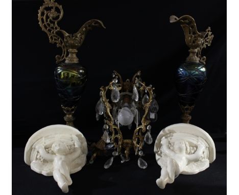 A pair of Baroque design gilt metal mounted lustre glass ewers; a pair of pottery wall brackets, each cast as putti; a gilt m