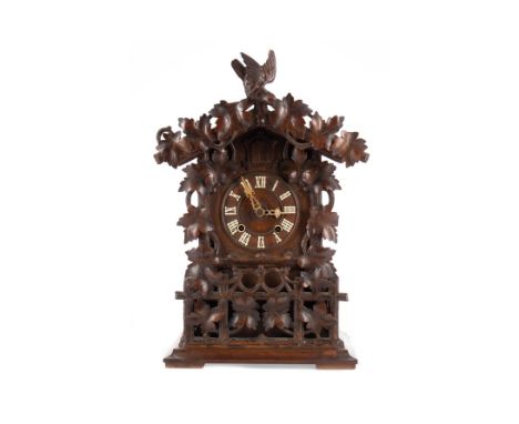 EARLY 20TH CENTURY SWISS CUCKOO CLOCK, with two train movement, the chapter ring with Roman numerals, the architectural case 