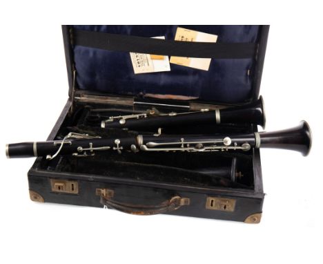 EBONY CLARINET BY CONSOLE, serial no. 3146, nickel keys and mounts, 59.5 long, in fitted case, with another cased clarinet (2