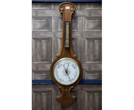LATE 19TH CENTURY WALNUT WHEEL BAROMETER, the case moulded with C-scrolls, the mercury thermometer with silvered dial, the ba