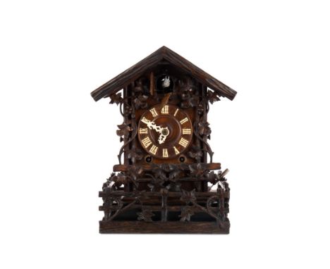 LATE 19TH CENTURY BLACK FOREST CUCKOO CLOCK, with two train movement, the chapter dial with Roman numerals, the architectural