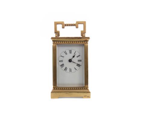 EARLY 20TH CENTURY CARRIAGE CLOCK, the white enamel dial with Roman numerals, in brass and bevelled five glass case with swin