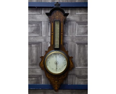 EDWARDIAN INLAID MAHOGANY WHEEL BAROMETER, the arched pediment with foliate cresting, the mercury thermometer and barometer w