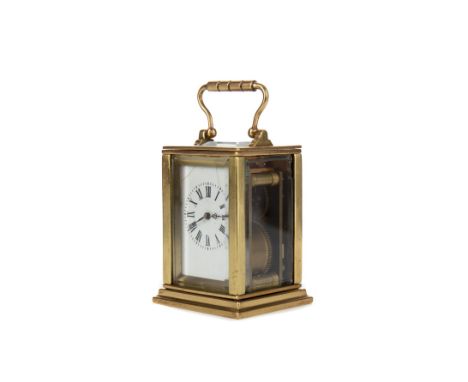 EARLY 20TH CENTURY CARRIAGE CLOCK, of small proportions, the white enamel dial with Roman numerals, the brass and bevelled fo