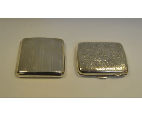 Silver - a silver cigarette case, chased and engraved overall, Chester 1922 (96.4 g); another, engine turned, Birmingham 1926