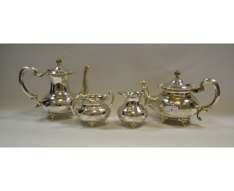 A four piece E.P.N.S  tea and coffee service, engraved with vacant cartouches, flowers and foliage, flowerhead and scroll han