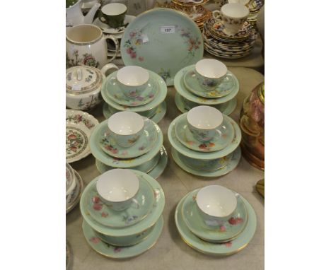 A Worcester part tea service painted with floral bouquets on an apple green ground 