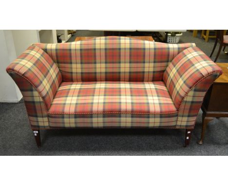 An early 20th century drop arm sofa, upholstered in Tartan fabric, slender tapering supports, casters 