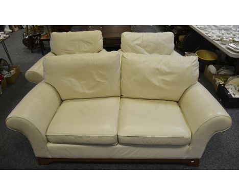 A contemporary two-seater sofa, upholstered in white leather; a pair of conforming armchairs (3)