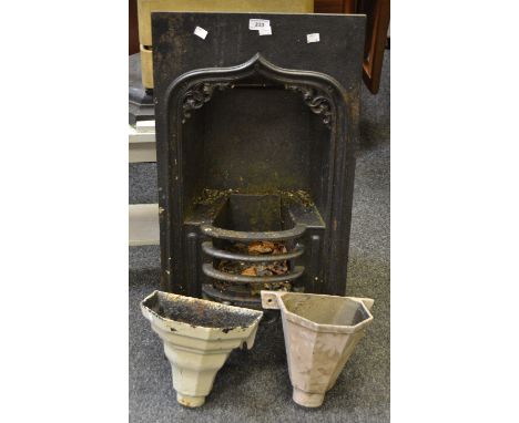 An Edwardian cast iron fire surround; a pair of hoppers (3)
