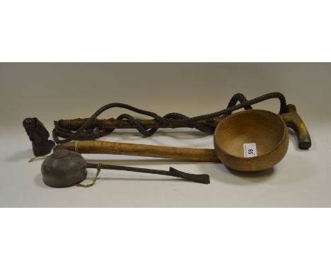 A silver mounted, Blackthorn and leather riding crop; an 18th century sycamore ladle; another similar; a black forest figure 