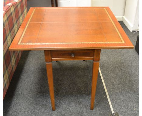A contemporary mahogany and satinwood inlay fold over card table, tooled leather inlay, slender tapering supports