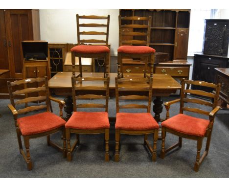 A set of six mid-20th century Old Charm oak ladder-back dining chairs