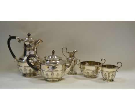 An EPBM four piece tea service, comprising teapot, hot water jug , cream and sugar bowl, applied with alternating strapwork, 