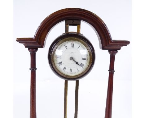 An Edwardian mahogany and brass rise and fall winding mantel clock by Long & Co of Cardiff, height 37cm 