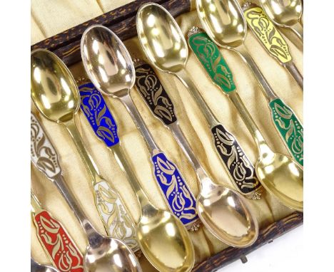 A set of 12 Horsens Solvvarefabrik Danish vermeil sterling silver and harlequin enamel coffee spoons, floral enamelled handle