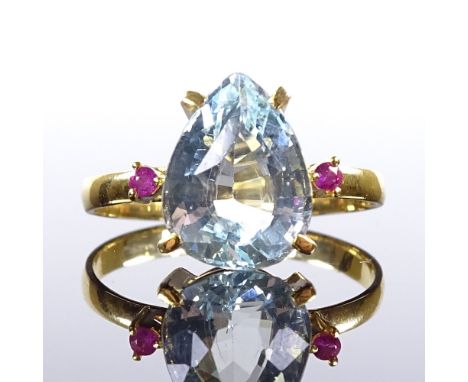 An 18ct gold 3-stone pear-cut aquamarine and ruby dress ring, aquamarine length 10.8mm, size L, 2.1gVery good original condit