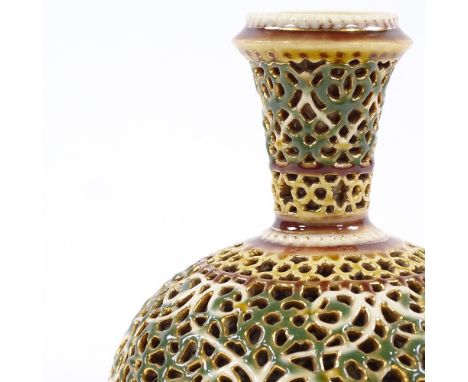 A Zsolnay reticulated porcelain narrow-necked vase with gilded highlights, height 11cm, diameter 11.5cm 