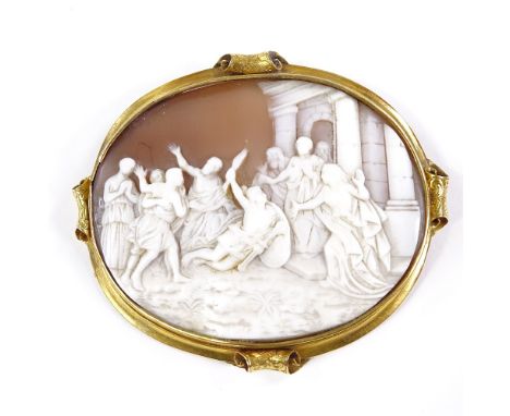 A Victorian large relief carved shell cameo brooch, depicting people gathering to watch a miracle, in unmarked yellow metal s