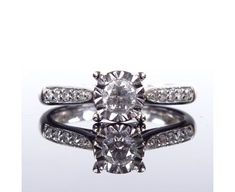 An unmarked gold solitaire diamond ring, illusion setting with diamond set shoulders, total diamond content approx 0.34ct, se