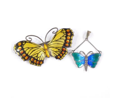 An Art Nouveau silver and peacock enamel butterfly pendant, by Charles Horner, and a sterling silver and enamel butterfly bro