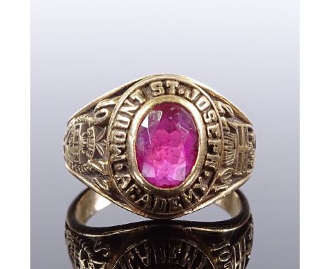 An American 10ct gold Mount St Joseph Academy ruby college graduation ring, dated 1972, setting height 13.5mm, size L, 6.3gVe
