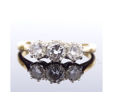 An unmarked gold 3-stone diamond ring, total diamond content approx 0.6ct, setting height 4.9mm, size K, 2.3gVery good origin